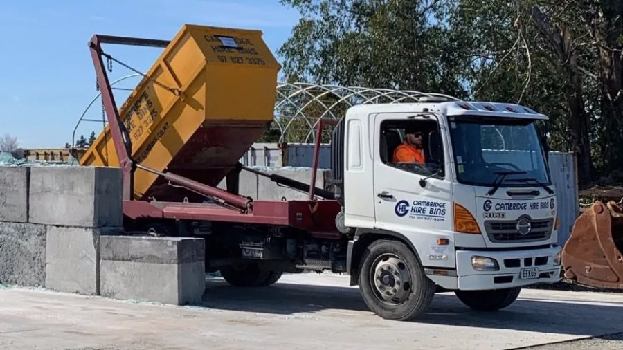 truck dumping rubbish from skip